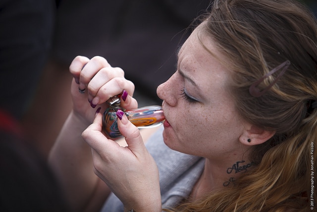 Teen Smoking Pot from Glass Pipe