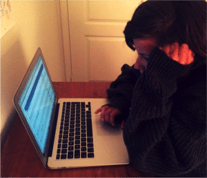 Parent Researching Cutting Epidemic on Laptop